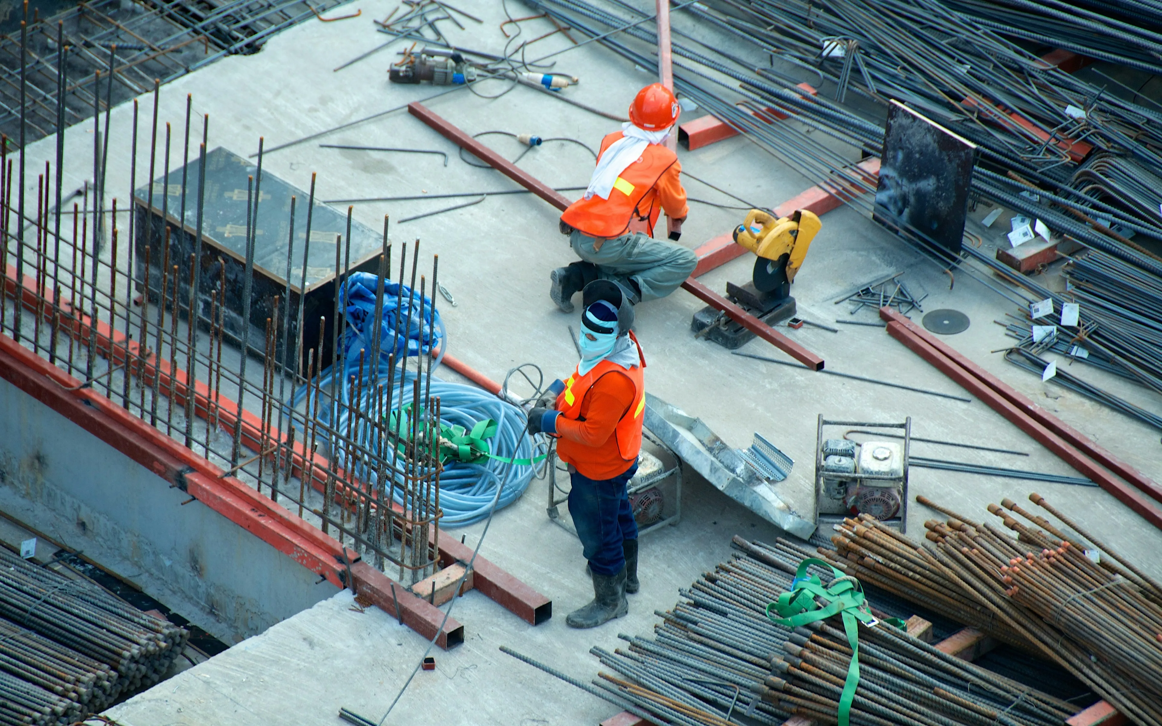 Steel rebar and structural beams on a concrete construction site